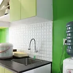 Compact Studio Room The Jarrdin Cihampelas Apartment By Travelio